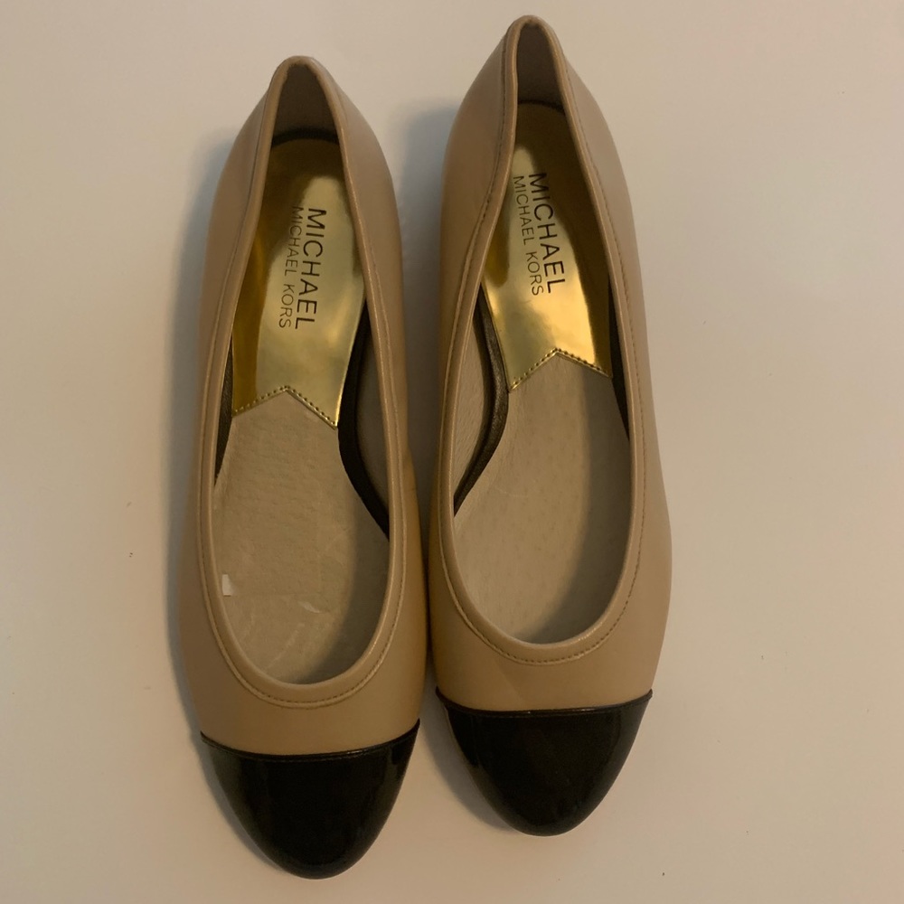 Michael Kors beige and black ballet flats.